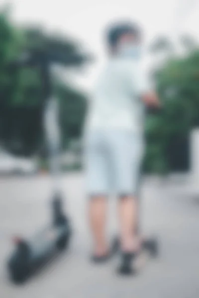 Blur Background Back Young Boy Riding One Wheeled Push Scooter — 图库照片