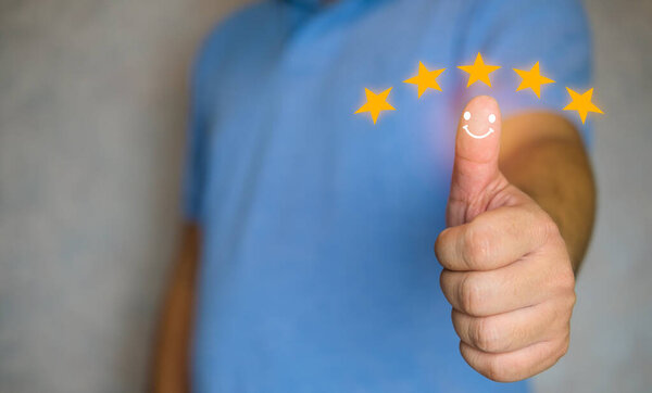 Customer hand with thumb up positive emotion smiley face icon and five star. Thumb up five star visual symbol to increase rating of service
