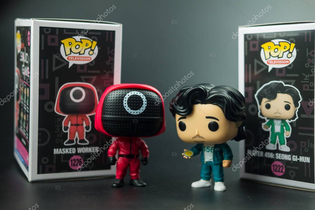 Samut Prakan, Thailand - March 22, 2022 : Funko Pop! TV X Squid Game from the South Korean Netflix series. Masked Worker (1226) and Player 456- Seong Gi-hun (1222)