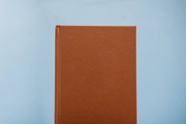 Copper color notebook on a white background