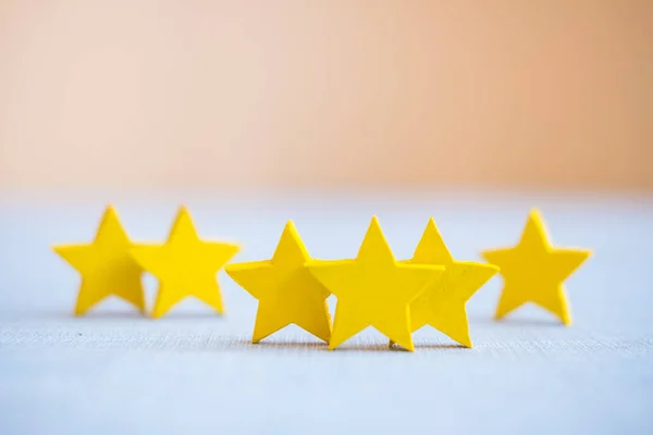 Three stars (3), concept about positive customer feedback and review, excellent performance, the evaluation of critics and visitors. Quality level, good service.