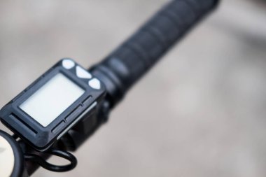 The handlebar of the electric scooter with a empty display.