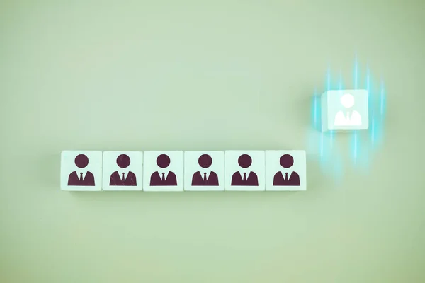 Choose an executive standing out of the crowd. Select team leader. Human resources and corporate hierarchy concept - recruiter complete team by one leader person (CEO) represented by gold cube and icon.