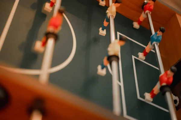 Close up of plastic table football game, table soccer. Sport in home concept