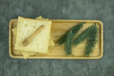 Fresh homemade slide bread on wood tray