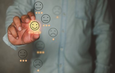 User give rating to service experience on virtual screen for customer review satisfaction feedback survey concept. Customer can evaluate quality of service leading to reputation ranking of business.