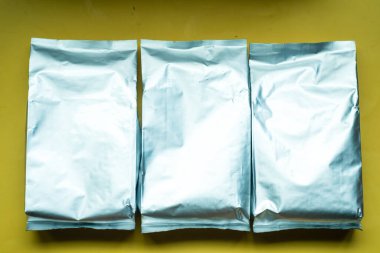 Blank foil food or drink bag. Packaging valve and seal template mockup. Metallic coffee tea retail package design.