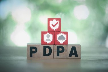 Personal Data Protection Act or PDPA concept. PDPA wood block blocks with shield, human and cloud computing icons for protection from data theft. provide protection for individuals.
