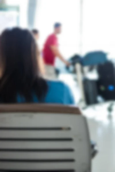Blur Fondo Mujer Viajero Sentado Silla Pasajeros Salón Del Aeropuerto —  Fotos de Stock