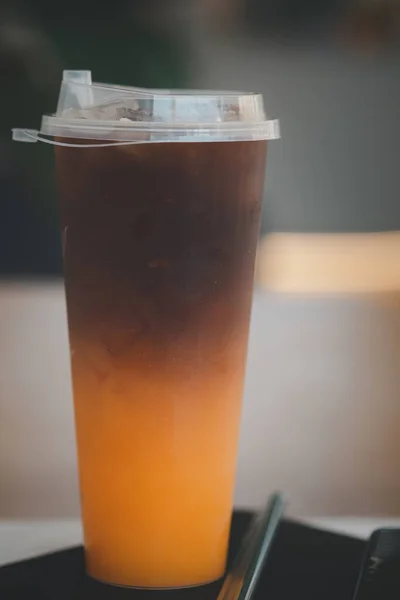 Iced black coffee mix with orange juice