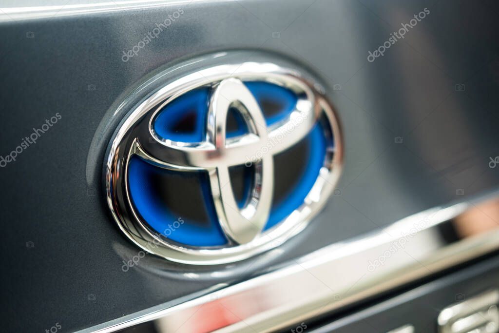 Samut Prakan, Thailand - September 10, 2022 : Close up of Toyota logo on brand Toyota Hybrid model. Toyota hybrid logo. Hybrid emblem.
