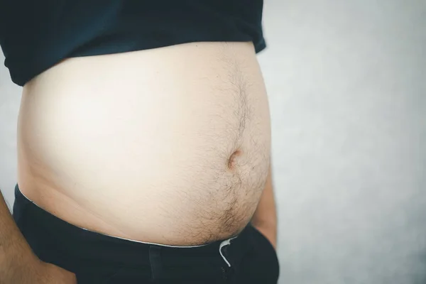 Close-up of man overweight obese man his big belly