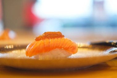 Grilled salmon sushi. Japanese cuisine, Japanese food. Traditional sushi.