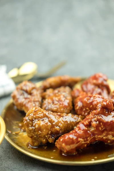 Fried chicken with sauce in Korean style, close up