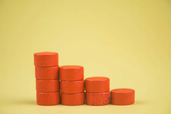 Bar graph made of red building blocks. Business concept. Red wood cube blocks like bar graph symbolizing sales growth.