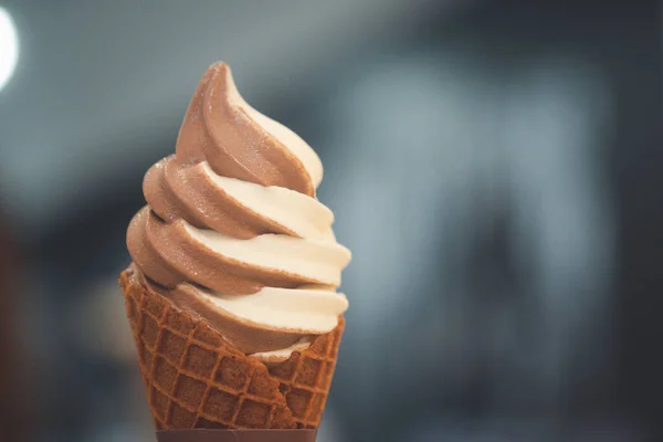 Mixed flavor ice cream cone soft serve in waffle cone