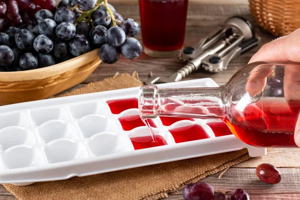 Pouring Wine Ice Cube Tray Rustic Wooden Table Frozen Wine — стоковое фото