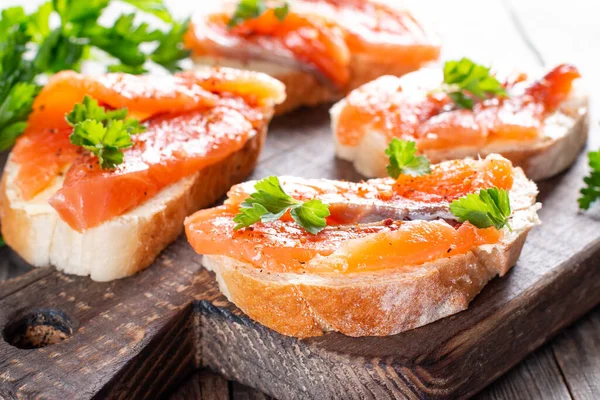 Slices Fresh Baguette Butter Salmon Served Wooden Board Table — Stock Photo, Image