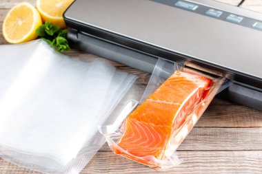 Salmon fillets in a vacuum package. Sous-vide, new technology cuisine.