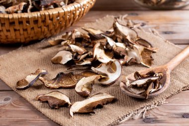 Dried mushrooms on a rustic wooden table