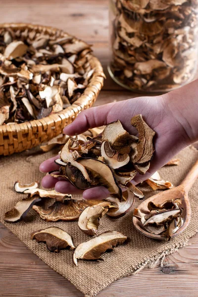 Collect and dry mushrooms in autumn, porcini mushrooms - a delicious ingredient for sauces and goulash on a rustic wooden table