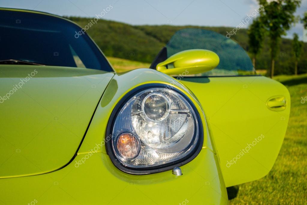 Detail of front view on green Porsche Boxster