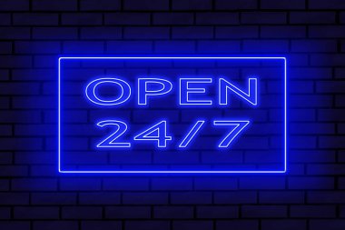 Tuğla duvardaki neon levhası. 24 saat çalışıyor..