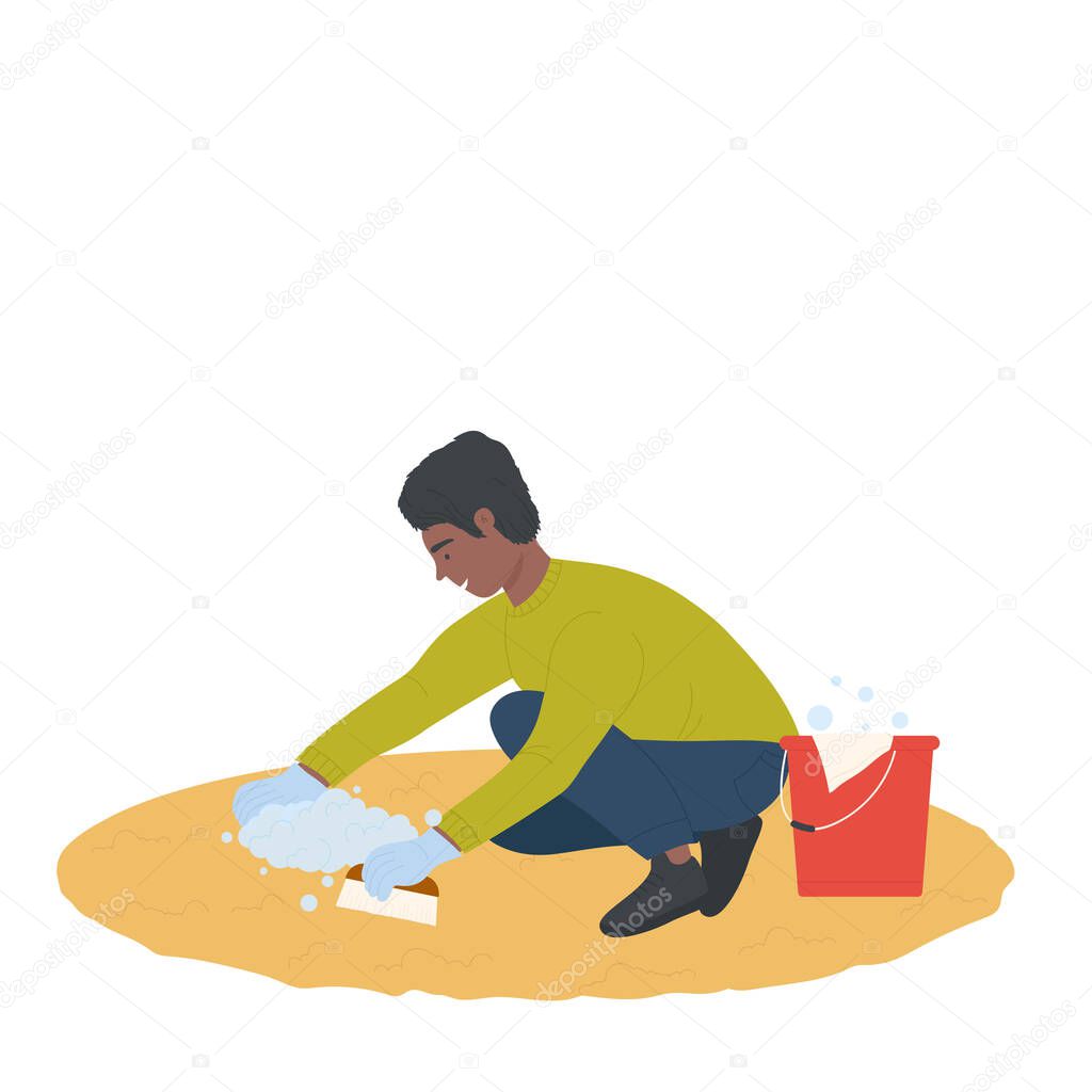 Young boy cleaning the floor