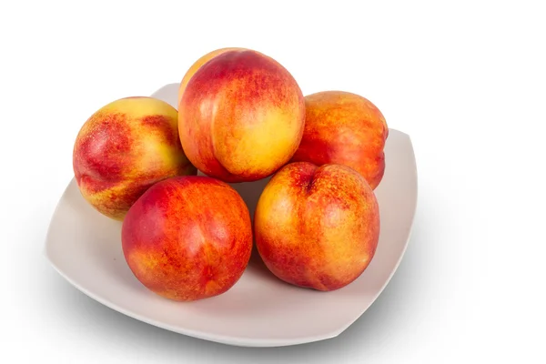 Plate of ripe nectarines — Stock Photo, Image