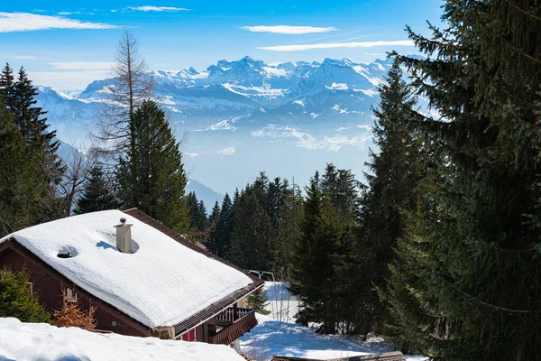 Majestic unique misty blue alpine skyline aerial panorama of Rigi resort. Snow-capped Chalets, hotels, wooden lodging cabins, iced Swiss Alps, blue sky. Mount Rigi, Weggis, Lucerne, Switzerland. — Stock Photo, Image