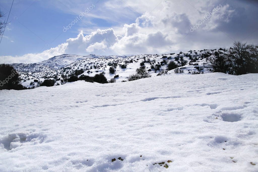 Pristine snow, hiking paths and trails at over 2000 m altitude on Psiloritis mountain frozen heights. Heraklion, Crete Greece