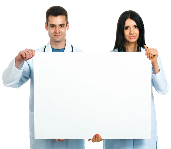 Lékaři s deskou — Stock fotografie