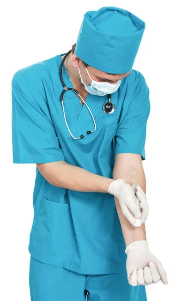 Médico con una jeringa — Foto de Stock