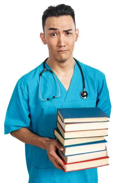 Студент-медик с книгами — стоковое фото
