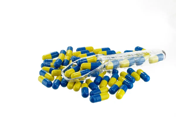 Pílula amarela e azul — Fotografia de Stock