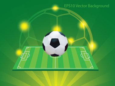 Futbol ve sarı ve yeşil arka planlı alan