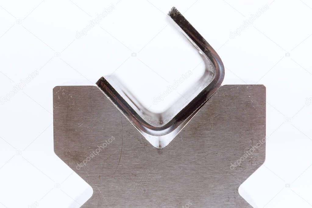 Sheet metal bending tool and equipment isolated on a white background. Bend tools, press brake punch and die.