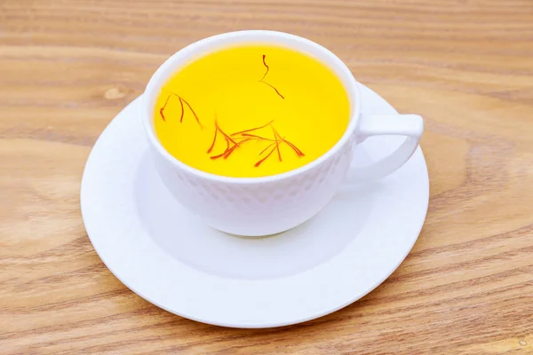 Saffron Drink White Cup Wooden Background Tea Made Red Stamens —  Fotos de Stock