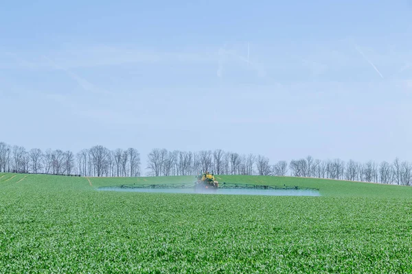 Spraying Green Field Large Tractor Modern Technology Works Field — 스톡 사진