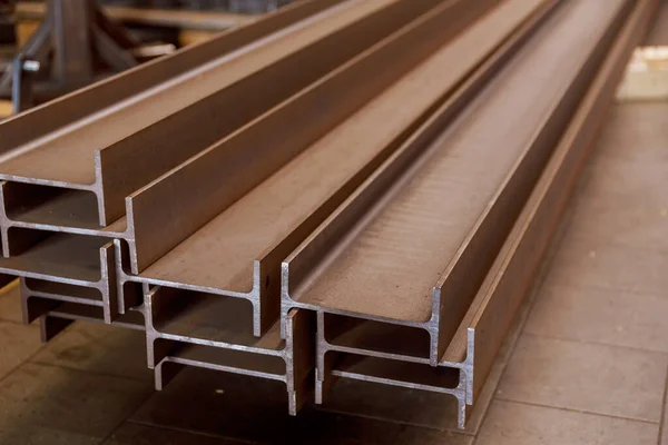 The stack of rolled metal is at the factory, overlooking the steel profile. Heavy metallurgy.