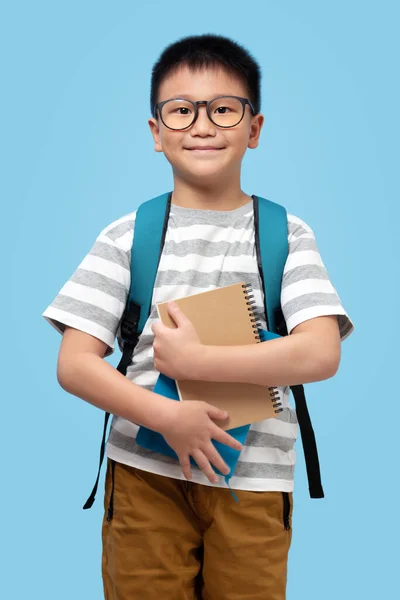 Kid Glasses School Backpack Holding Books Smile Blue Background — Fotografia de Stock