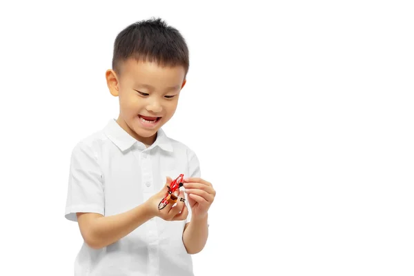Happy Kid Playing Toy Wearing White Shirt Isolated White Background — 스톡 사진