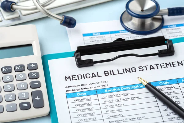Medical billing statement, closeup with calculator