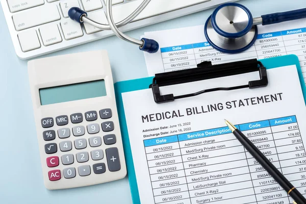 Medical billing statement with calculator and doctor tool on work desk, hospital payment, healthcare cost