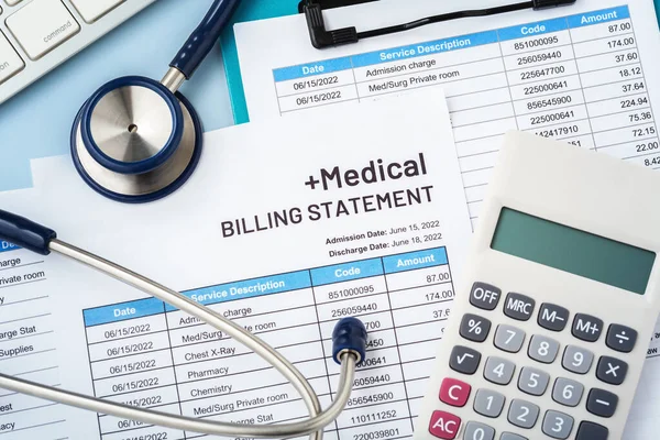 Medical billing statement with stethoscope and calculator, hospital and healthcare cost, top view