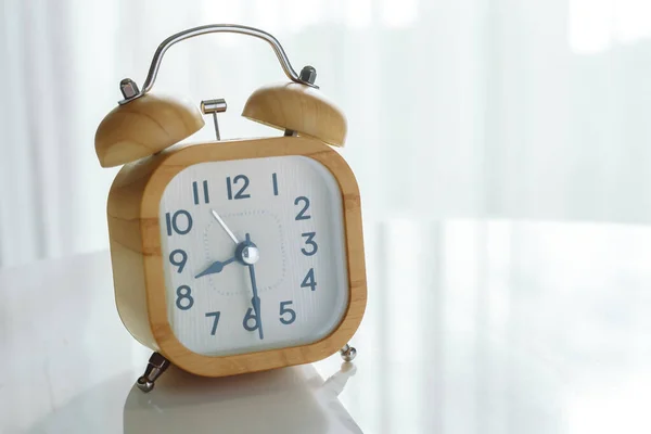 Alarm Clock Marble Table Blur Window Background — Zdjęcie stockowe