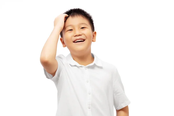 Verwirrtes Kind Lacht Mit Kratzendem Kopf Auf Weißem Hintergrund — Stockfoto