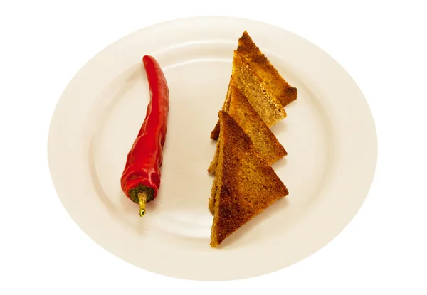 Zwei herzförmige Toastbrot und würziger roter Pfeffer — Stockfoto