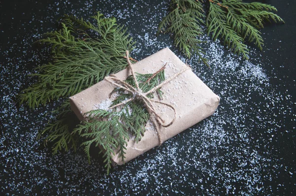 One Gift Wrapped Kraft Paper Fir Sprigs Black Board Gift — Stockfoto