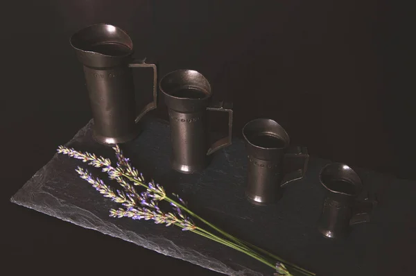 Still Life Vintage Measuring Cups Set Black Rough Stone Board — Stockfoto